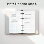 
Personal kariertes Notizpapier in Benutzung, handschriftlich beschrieben